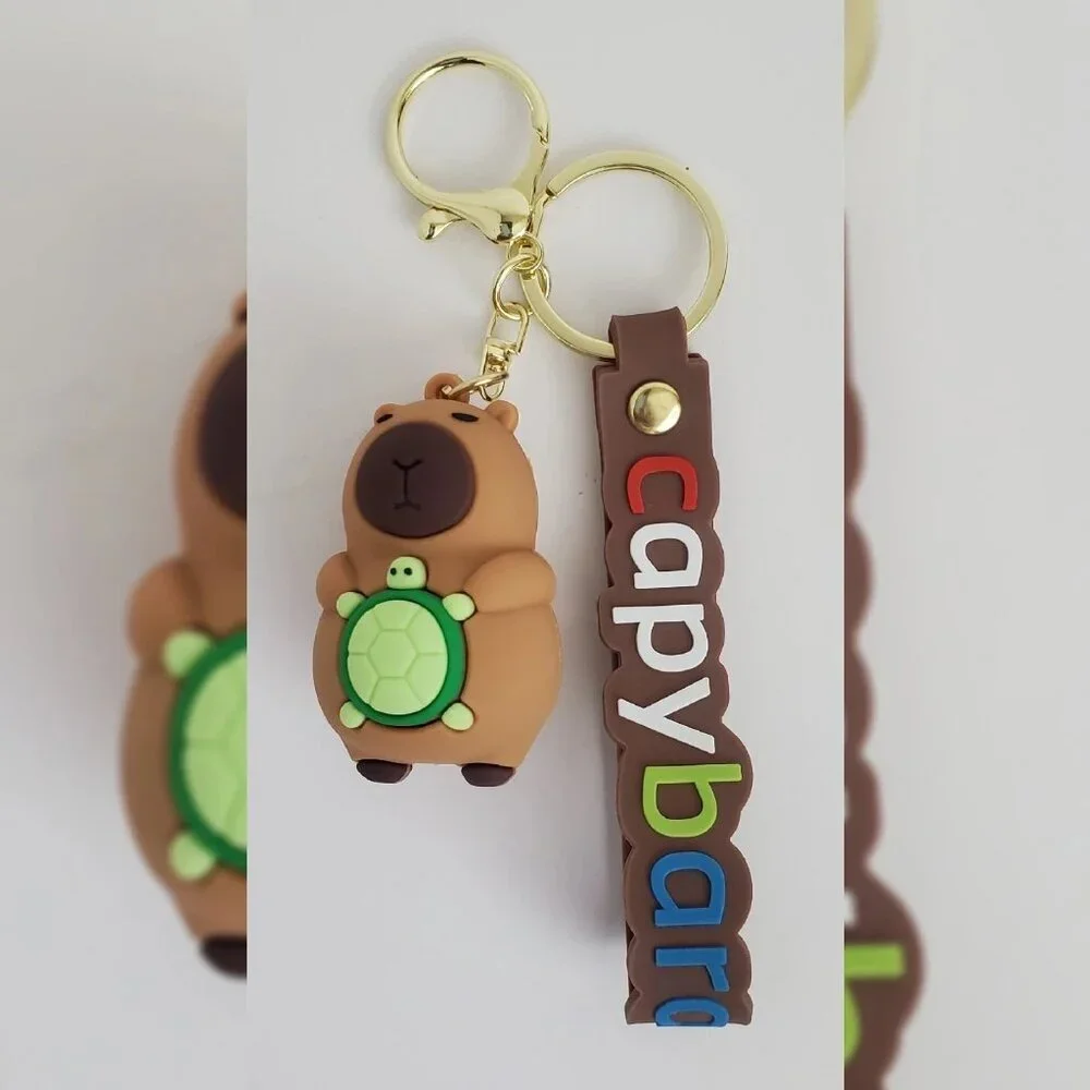 NWT CAPYBARA KEY CHAIN DIFFERENT ACTIONS 3D LOGO